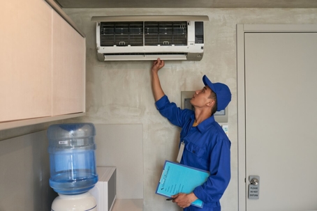 Technician checking the AC unit