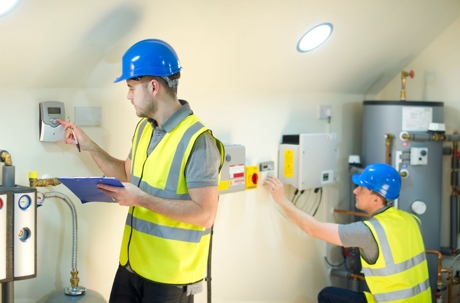 technician checking furnace unit