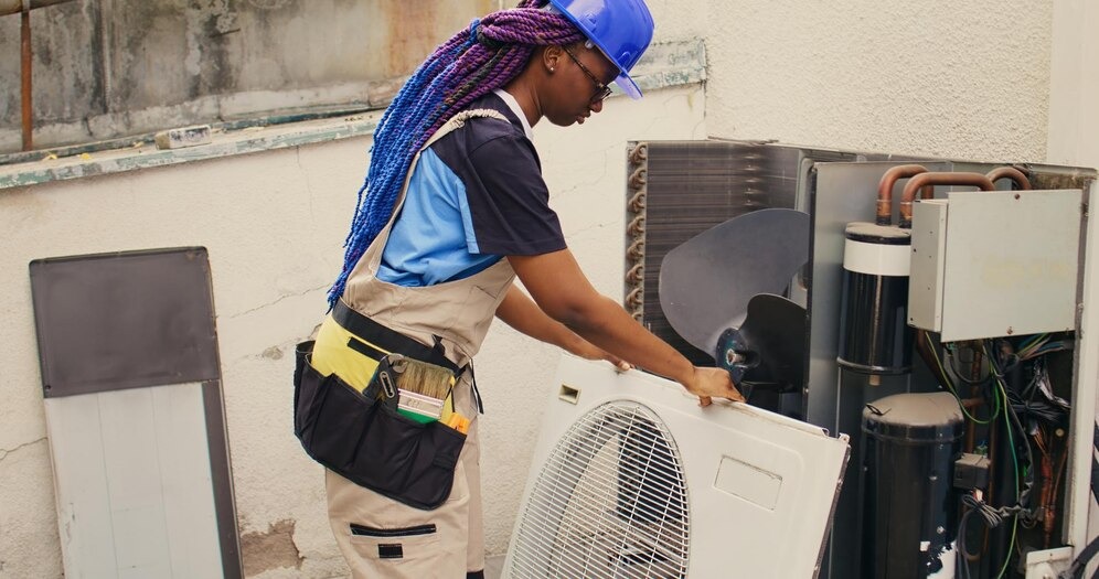HVAC technician wearing a hardhat